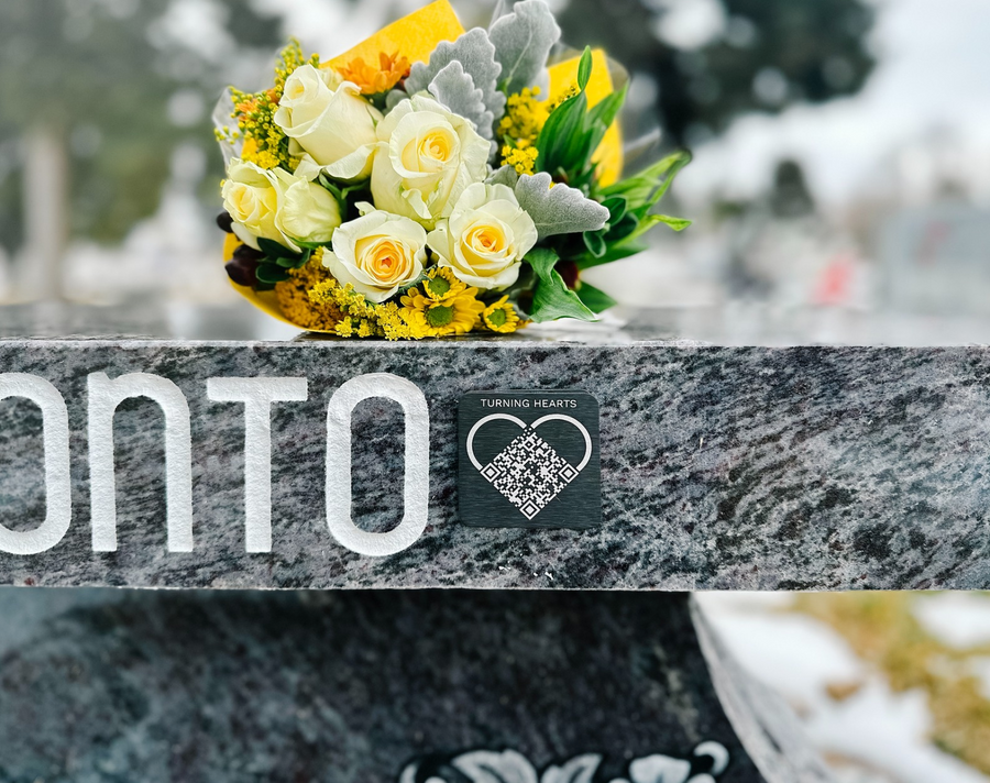Family honoring a loved one with Turning Hearts medallion